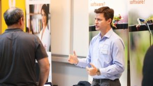 Accentis-staff-at-a-trade-show-exhibiting-the-software